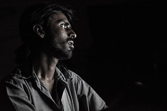 Dramatic Black and White Portrait of a Contemplative Man