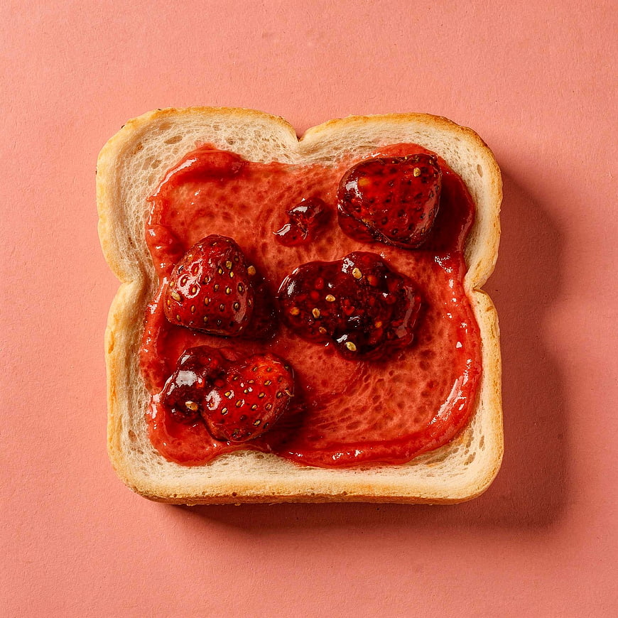 Top View Strawberry Jam Toast on Pink Background