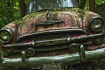 Rusty vintage Buick Dynaflow abandoned in forest