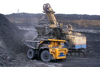 Giant Mining Excavator Loading Coal into Dump Truck