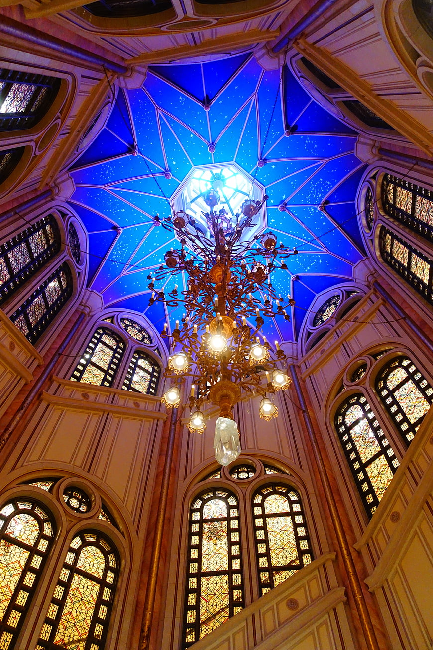 Interior View of Disneyland Castle Dome with Chandelier and Stained Glass