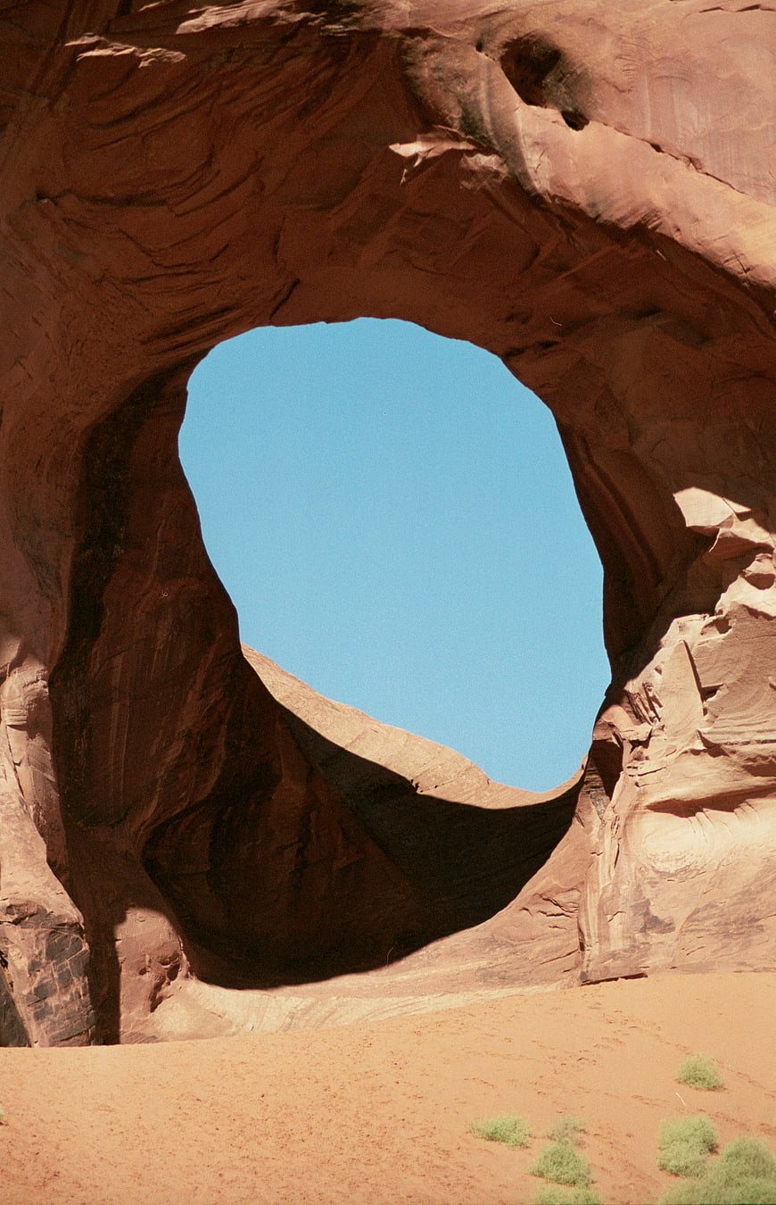 Ear of the Wind Rock Arch in Monument Valley Desert