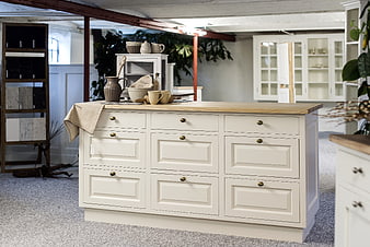 White Shaker Kitchen Island With Oak Worktop In Showroom
