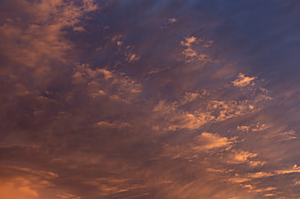 Dramatic sunset sky with orange and purple clouds