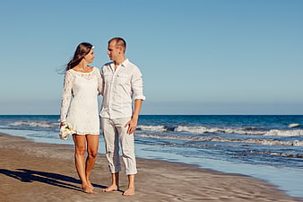 Romantic Wedding Couple Walking on Sandy Beach
