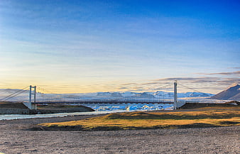 Suspension Bridge Over Glacial River in Iceland Landscape