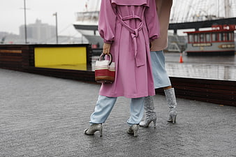 Two Women Walking in Pink Coat and Silver Boots