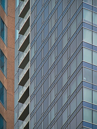Modern Glass Office Building Facade with Geometric Patterns