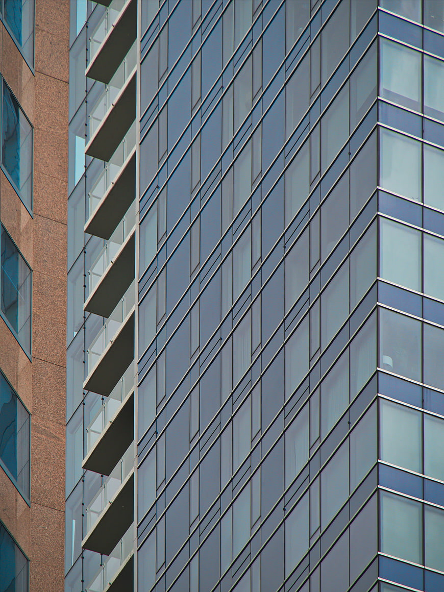 Modern Glass Office Building Facade with Geometric Patterns