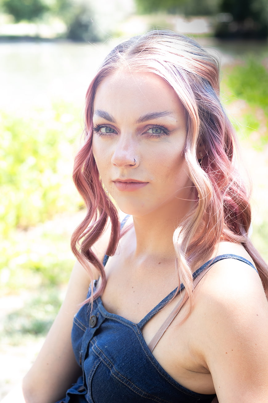 Portrait of young woman with pink hair outdoors