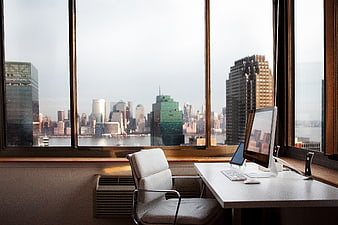 Modern office desk with city skyline view