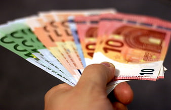 Hand Holding Fan of Euro Banknotes