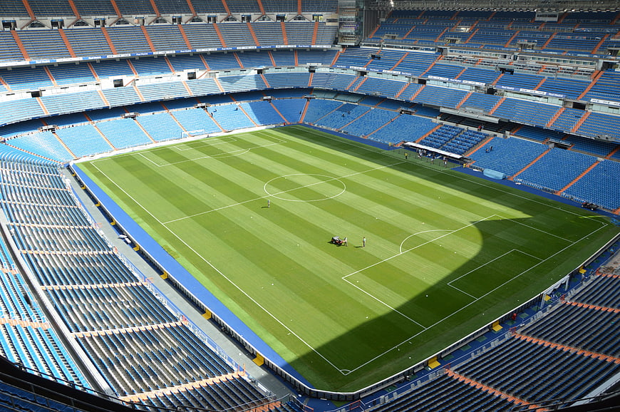 Wide aerial view of empty Santiago Bernabeu stadium pitch