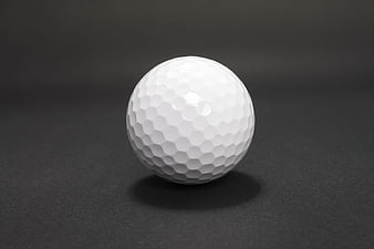 White Golf Ball on Dark Background