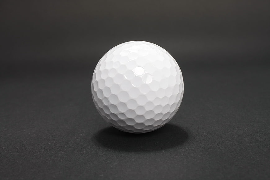 White Golf Ball on Dark Background