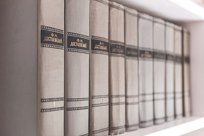 Vintage Dostoevsky Book Set on White Shelf