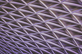 Abstract Geometric Ceiling Pattern with Purple Lighting