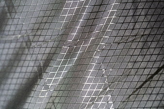 Close-up of black mesh fabric texture with grid pattern