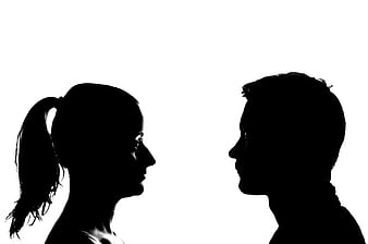 Silhouette of Man and Woman Facing Each Other in Profile
