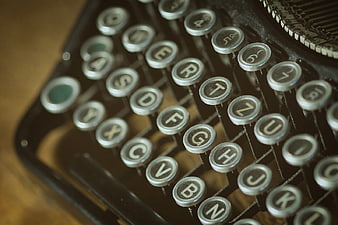 Closeup Vintage Typewriter Keys on Wooden Desk