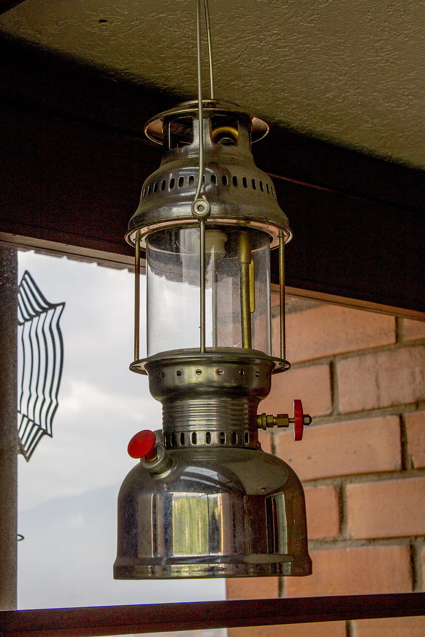 Vintage Hanging Oil Lantern on Porch
