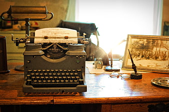 Vintage Typewriter on Wooden Desk with Nostalgic Atmosphere