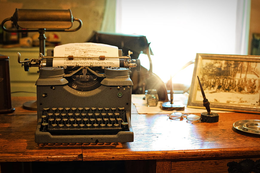 Vintage Typewriter on Wooden Desk with Nostalgic Atmosphere