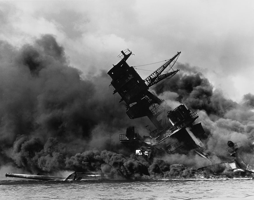 USS Arizona sinking at Pearl Harbor in black and white