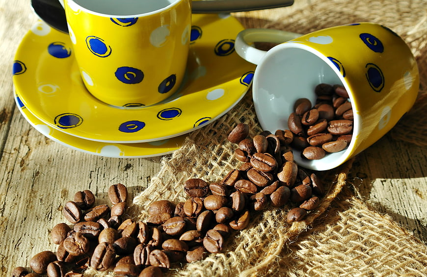 Yellow Polka Dot Coffee Cups with Spilled Beans