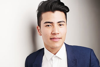 Portrait of handsome young businessman in blue suit