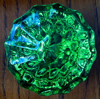 Top View of Textured Green Glass Doorknob on Wood