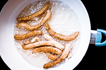 Top View of Churros Frying in Hot Oil