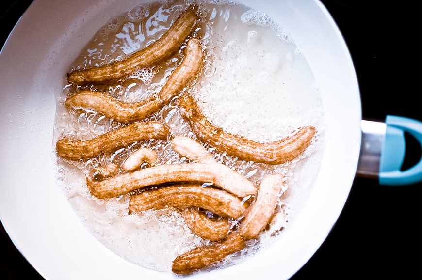 Top View of Churros Frying in Hot Oil