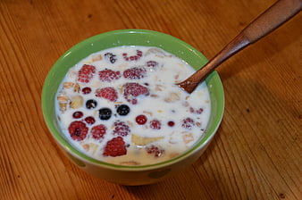 Healthy Breakfast Cereal Bowl with Berries and Milk