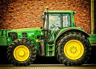 Green John Deere 6930 Tractor Parked Against Red Brick Wall
