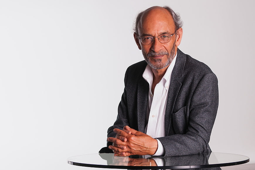 Senior Indian Businessman Portrait at Glass Table