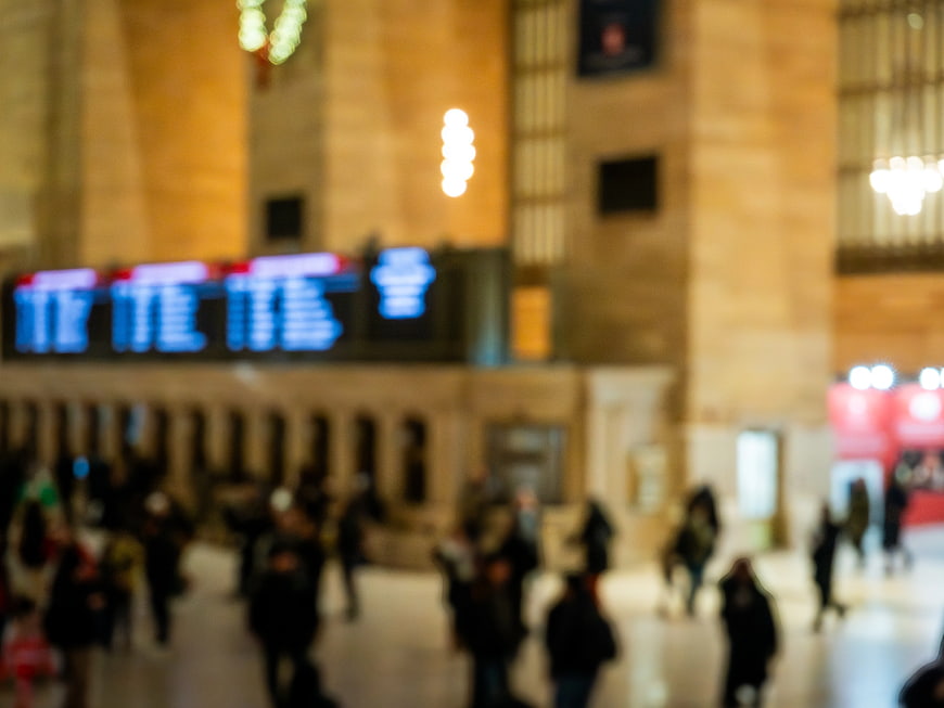 Blurred Interior of Grand Central Terminal with Departure Board