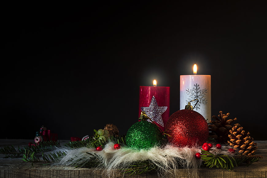 Christmas Candles and Ornaments on Wooden Table