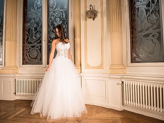 Woman in White Wedding Dress in Elegant Hall