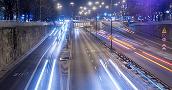 Long exposure night traffic on urban highway with light trails