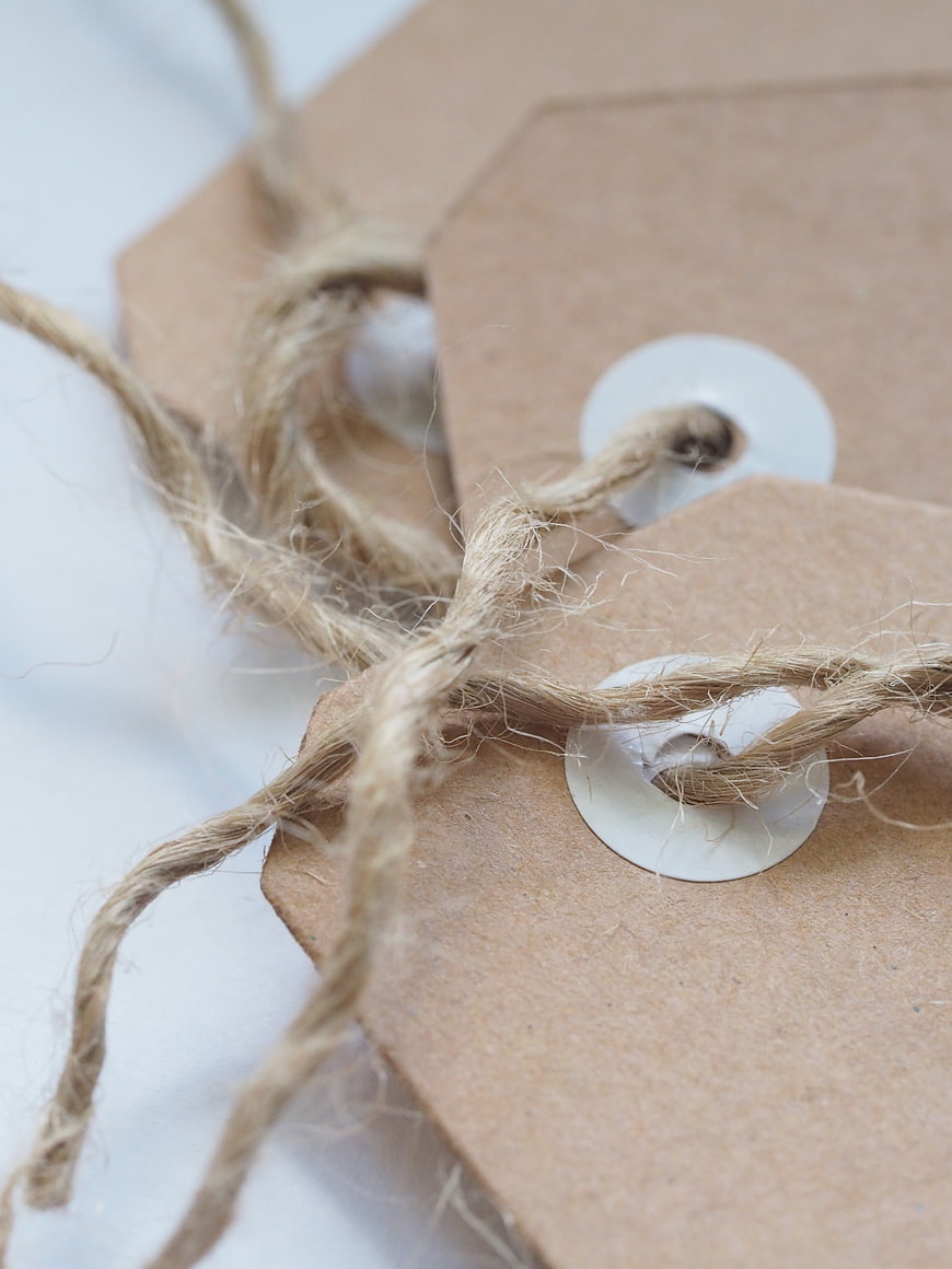 Close-up of kraft paper tags with twine string