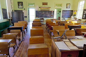 Historic One-Room Schoolhouse Interior With Vintage Wooden Desks