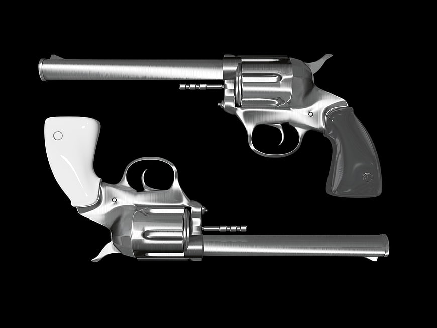 Two Silver Revolvers on Black Background