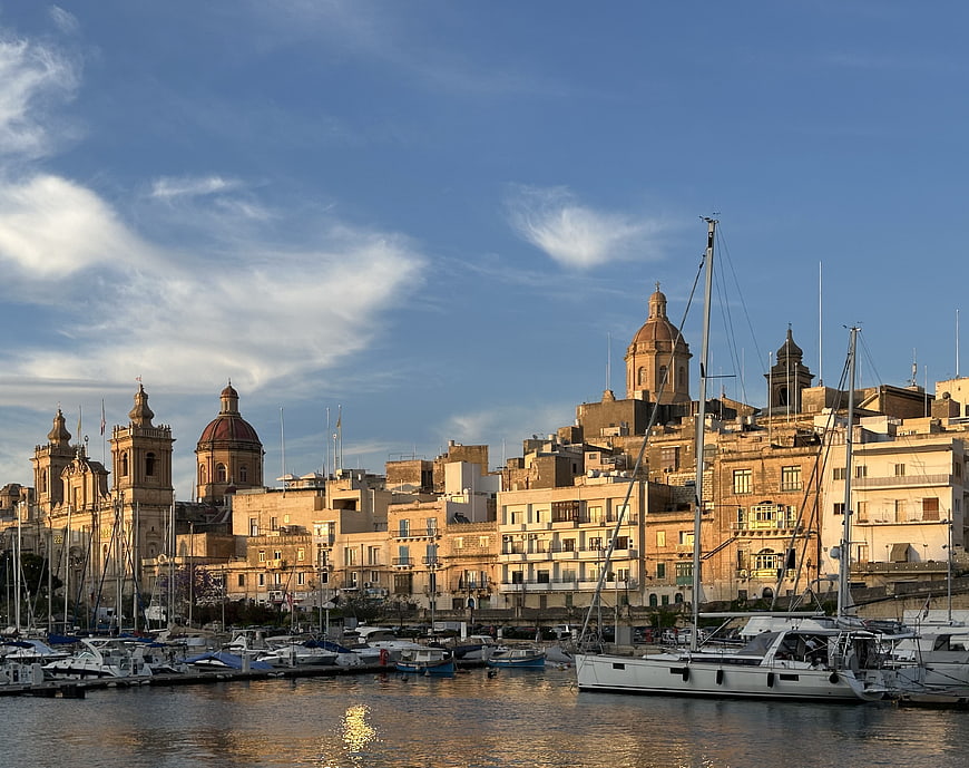 Mediterranean Harbor Cityscape With Historic Architecture And Boats