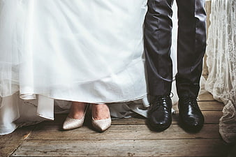 Bride and Groom Wedding Shoes on Wooden Floor