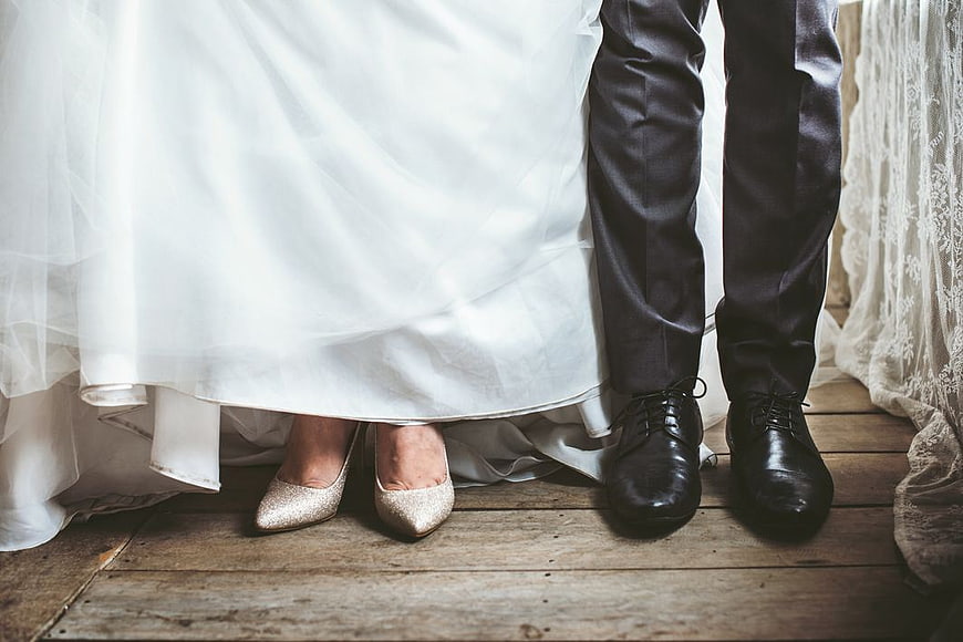 Bride and Groom Wedding Shoes on Wooden Floor