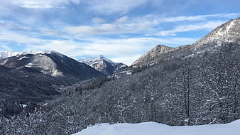 Snow-Covered Mountain Landscape with Blue Sky