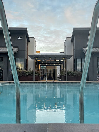 Modern Hotel Pool with Symmetrical Architecture and Reflections