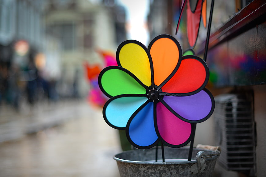 Colorful Rainbow Pinwheel Toy on Street