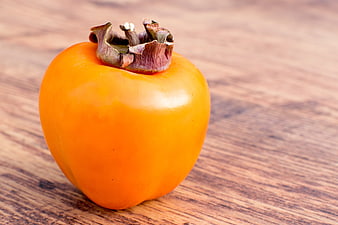 Ripe Orange Persimmon Fruit On Rustic Wooden Table